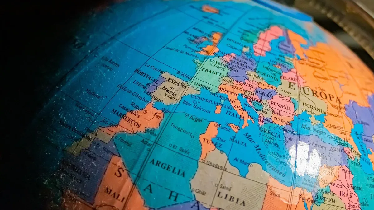 A close-up view of a globe, with the focus on the European continent and surrounding regions.