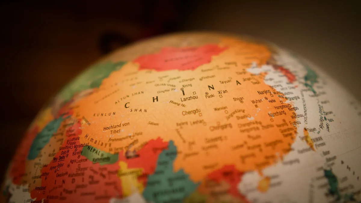 A close-up view of a globe with the country of China prominently displayed.