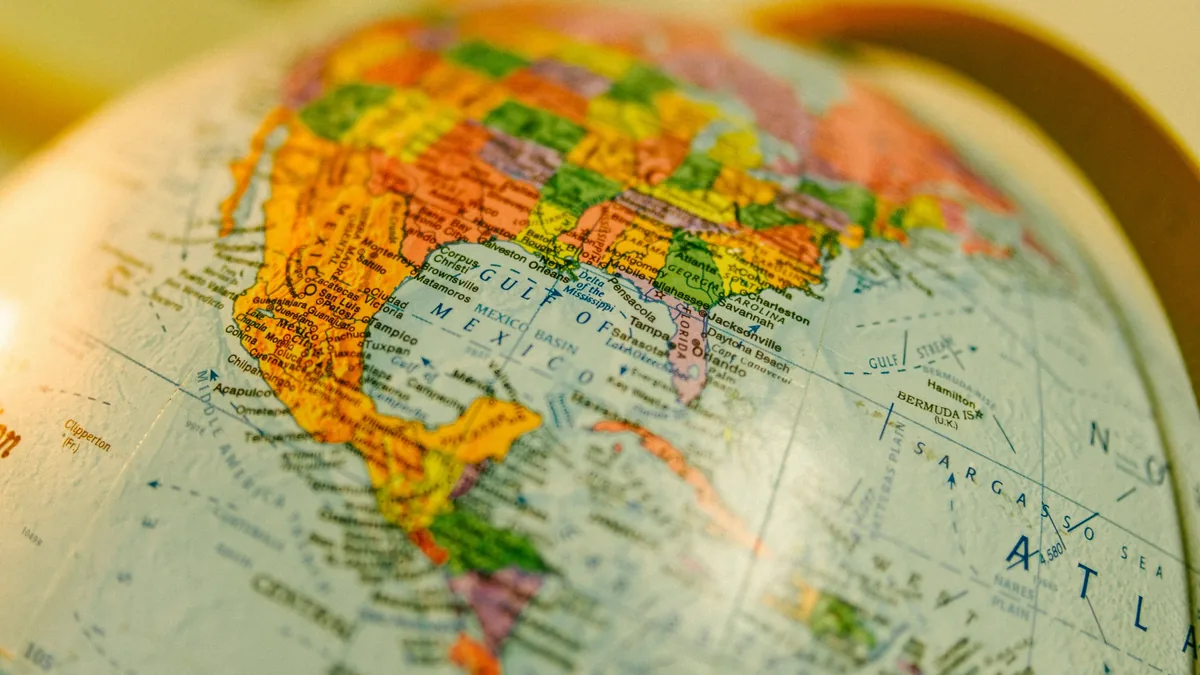 A close-up view of a globe with the Americas visible, featuring the United States, Mexico, and parts of Central and South America.